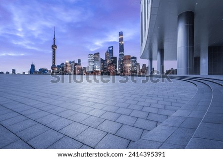 Empty square floor and modern city building sceney at night in Shanghai Royalty-Free Stock Photo #2414395391