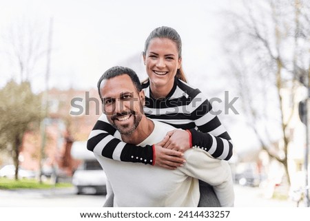 Portrait of happy couple having fun outdoors