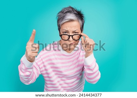 Photo of funny strict lady wear striped sweater hand arm spectacles pointing you isolated turquoise color background