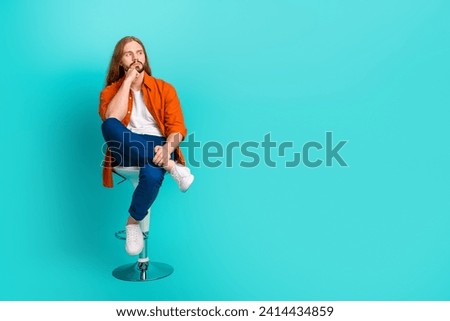 Full size photo of pensive guy dressed stylish outfit sit on stool thoughtfully look empty space isolated on turquoise color background Royalty-Free Stock Photo #2414434859