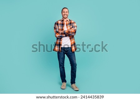 Full length photo of positive cheerful pleasant man wear flannel shirt jeans holding palms folded isolated on turquoise color background