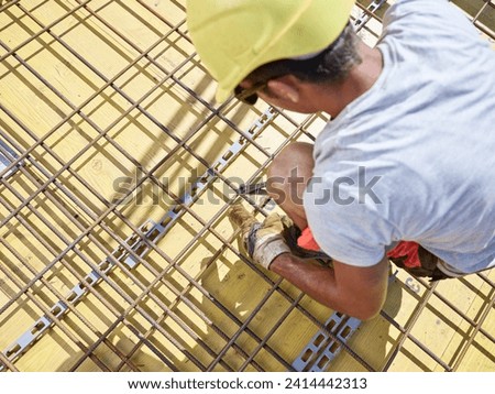 Construction worker fixing stock photo