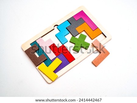 Top view of wooden block jigsaw puzzle on white surface
