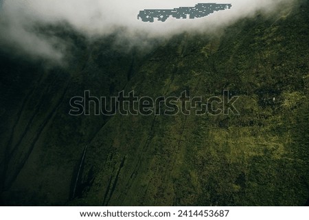 Clouds swirling around mountains of kauai as seen from helicopter. High quality photo
