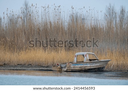 An old fishing boat on the shore of Lake Beysehir in Turkey.