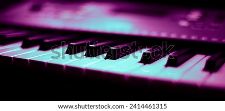 Piano keyboard in a moody setting