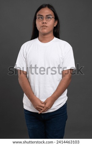 Portrait of native american man  with glasses isolated on studio background