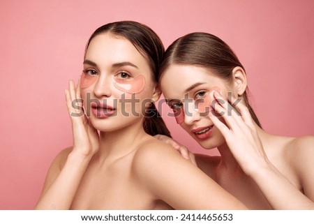 Refreshed radiance. Young girls emphasize their natural beauty sans makeup, embracing art of self-care with moisturized, hyaluronic under-eye patches Concept of beauty treatments, anti-aging, spa. Ad Royalty-Free Stock Photo #2414465653