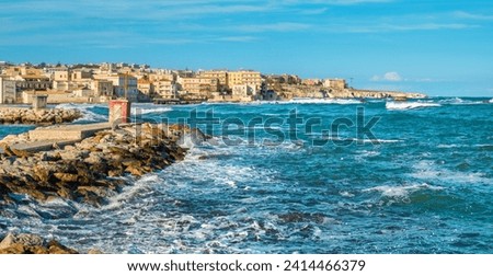 Panoramic view of stormy sea and Syracuse city. Sicily, Italy Royalty-Free Stock Photo #2414466379