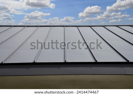 Standig Seam Metal Roof on sky background Royalty-Free Stock Photo #2414474467
