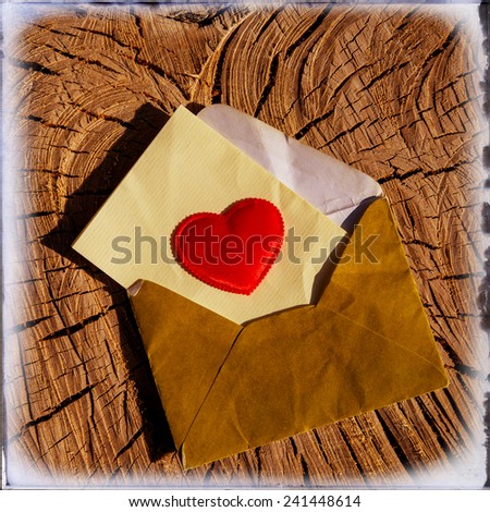Valentine heart and envelope on the background surface of the villages