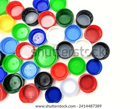 Top view of plastic bottle caps, isolated on white background. 
