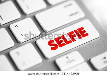Selfie is a self-portrait photograph, typically taken with a digital camera or smartphone, text concept button on keyboard