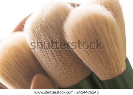 Macro bristles makeup brush,Brush tips in real-life color residue on bristles, isolated on white. Royalty-Free Stock Photo #2414496243