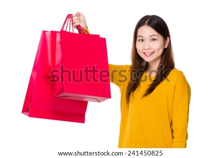 Woman hold with red shopping bag
