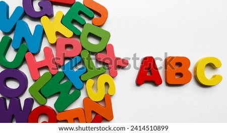 ABC wooden letters isolated on white background. ABC blocks connecting jigsaw puzzle. Symbol of business teamwork and baby kid intelligence development concept, cooperation, partnership.