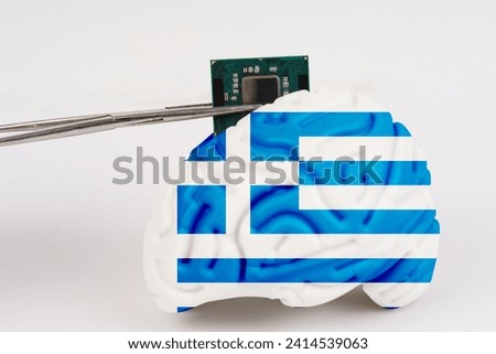 On a white background, a model of the brain with a picture of a flag - Greece, a microcircuit, a processor, is implanted into it. Close-up