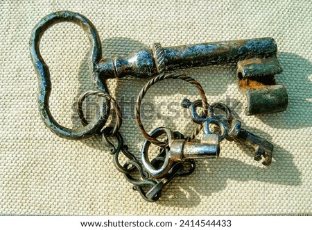 Vintage 18th century keys in a bunch Royalty-Free Stock Photo #2414544433