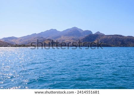 View of mountain landscapes from the sea. Background with selective focus and copy space for text