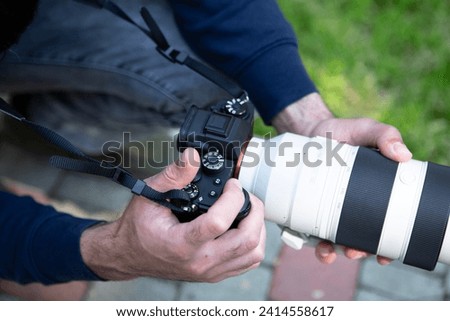 photographer taking photo with camera