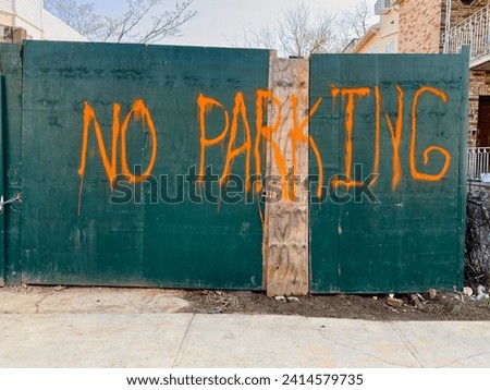 No parking signage on a wood door