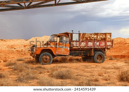 Rusty old abandoned truck in the desert outside Tom's Working Opal Mine along Stuart Highway in Coober Pedy, South Australia