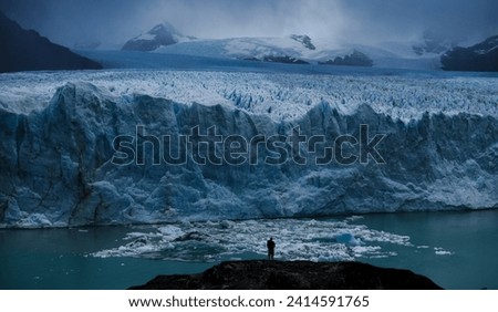 one man standing in drone of Glaciar Perito Moreno 