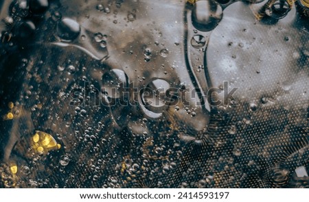 Dark abstract background with droplets.