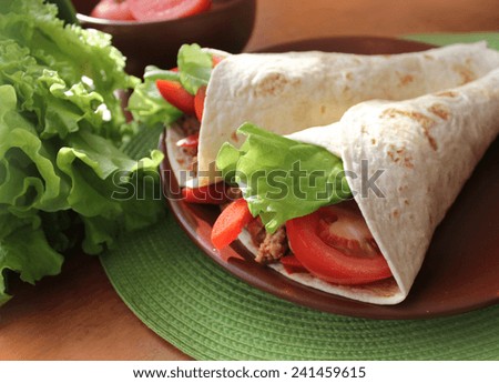 tortilla wraps with meat and vegetables 