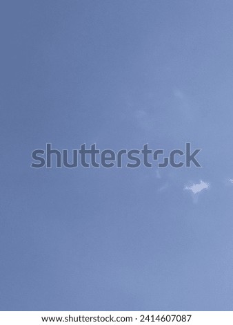 Raw photo of little cloud in the big blue sky