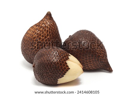 Half peeled and two whole fresh organic snake fruit delicious isolated on white background clipping path