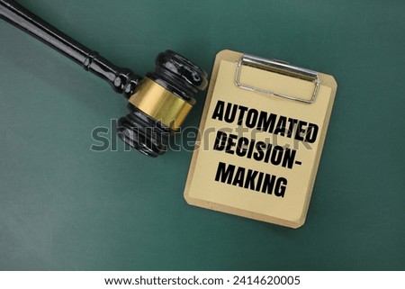 judge's gavel and paper board with the words automated decision-making. the concept of automatic decision making Royalty-Free Stock Photo #2414620005