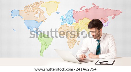 Businessman sitting at white table with colorful world map background