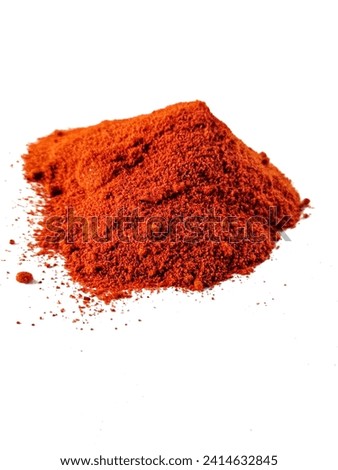 Dried red chili powder, white background
