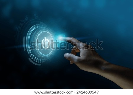 Finger about to press a power button. Hardware equipment concept. Composite between an image and a 3D background Royalty-Free Stock Photo #2414639549
