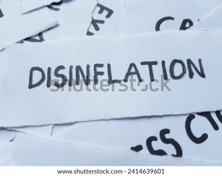 Disinflation writting on paper background.