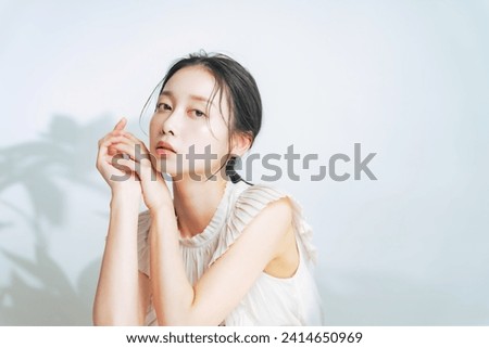 Beauty concept of middle aged Asian woman with natural makeup. Skin care. Cosmetics. Anti-aging. Royalty-Free Stock Photo #2414650969