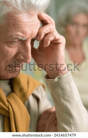 Portrait of a thoughtful sad senior man close-up