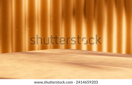 Vibrant setting for product placement: Yellowish orange platform angled, corrugated wall bathed in sunlight, casting soft shadows. Dreamy scene with whimsical dust particles. Royalty-Free Stock Photo #2414659203