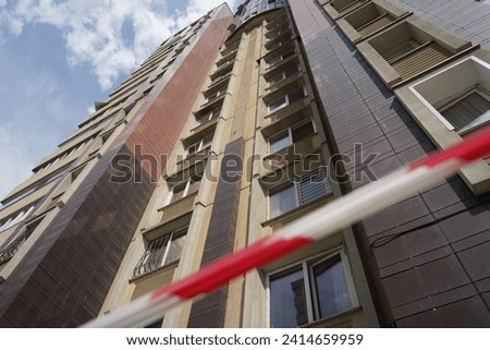 High-rise apartment building with a fencing tape
