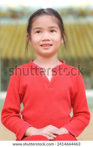 Asian girl in red dress with Chinese style background