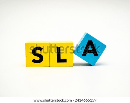 A coloured wooden block with word “SLA” on it. SLA stands for "service level agreement"