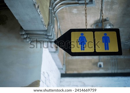 Entrance signs for women's and men's bathrooms
