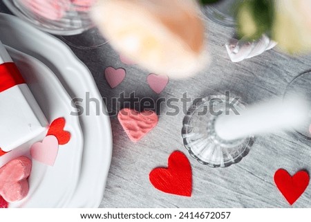 Romantic dinner table settings with hearts, top view