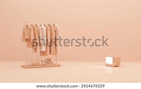 Apricot crush is trend color of the year 2024 Autumn Clothes hanging on a rack with pastel orange