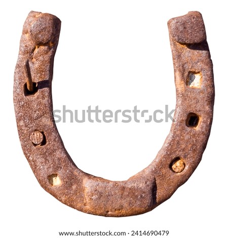An old, rusted horseshoe on a white background, symbol of luck. The rust gives the object a nostalgic patina, while the white background accentuates the simplicity and elegance of the lucky symbol. Royalty-Free Stock Photo #2414690479