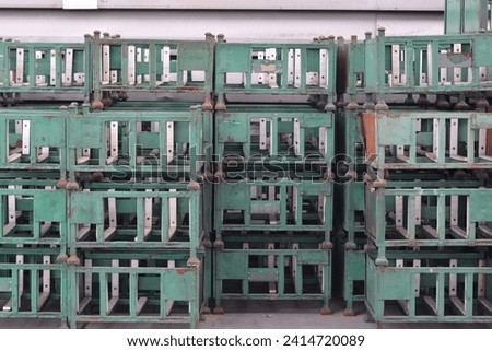 Green steel pallet or Steel basket for holding small steel bars to prevent them from falling.