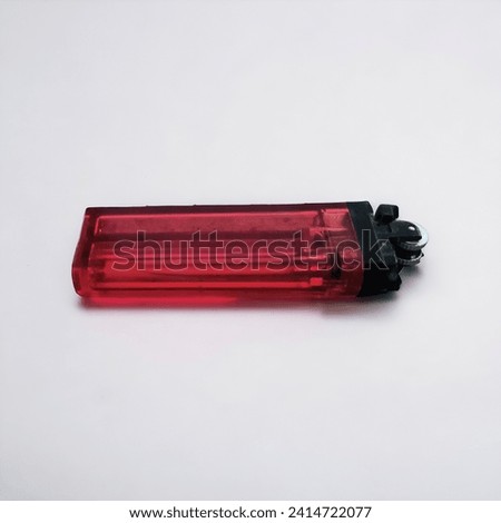 red lighter on a white background 