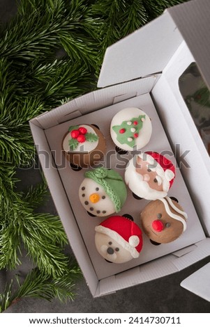 New Year's cakes and desserts with Santa Claus dark background