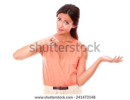Sad brunette lady with thumb down gesturing a bad job while looking at you disappointed and unhappy in white background - copyspace